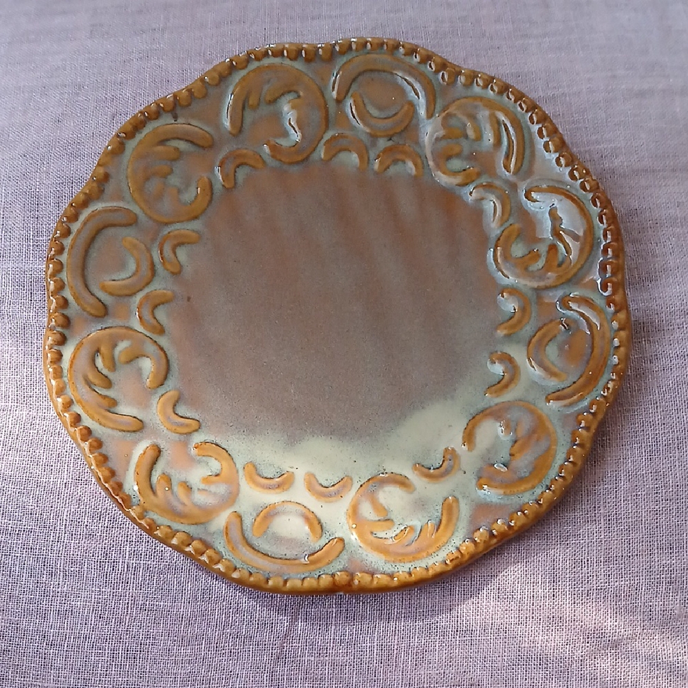 Handcrafted Ceramic Plate with Intricate Design
